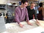 Senior Institute students, Spencer G. and Cat P. press a slab of clay for a ceramics project